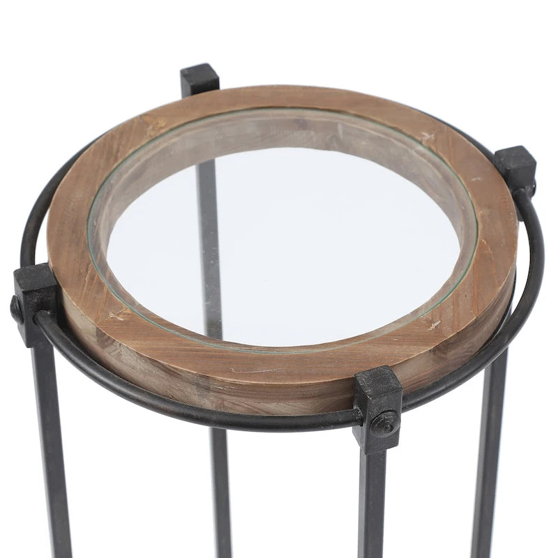 Set di 2 tavolini d'appoggio moderni rotondi, struttura in metallo nero, ripiano in vetro trasparente, cornice in legno di abete, salvaspazio