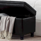 Panca contenitore imbottita in ecopelle nera capitonné con gambe in legno a fuso, panca pouf contenitore